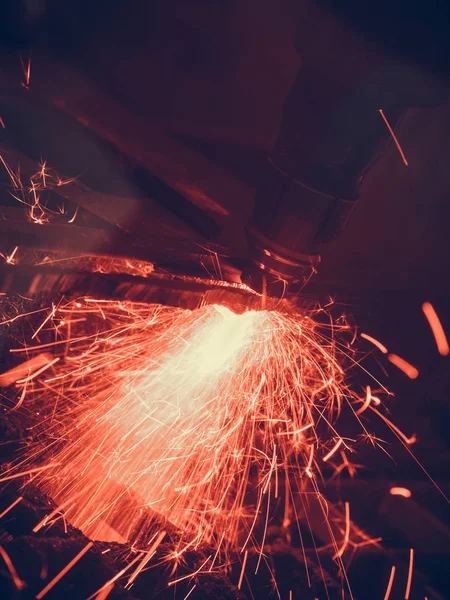 Laser cutting steel metal with bright sparks — Stock Photo, Image