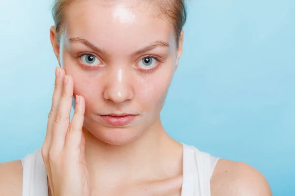 Woman in facial peel off mask. — Stock Photo, Image