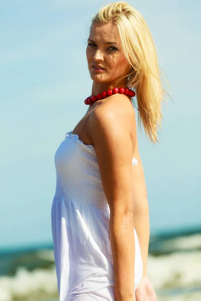 Beautiful woman wearing white dress, sky background — Stock Photo, Image