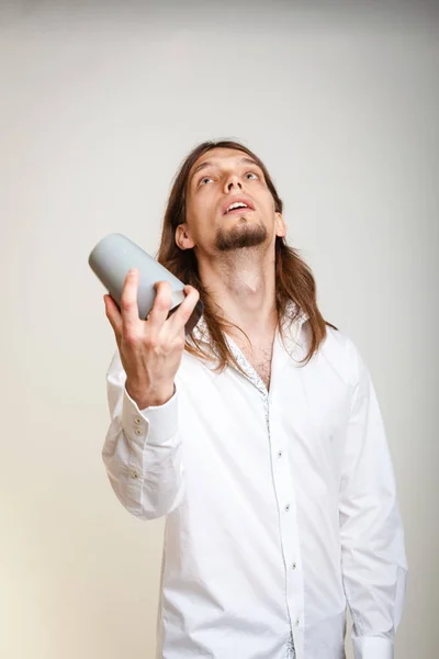 Young bartender shaking glasses. — Stock Photo, Image