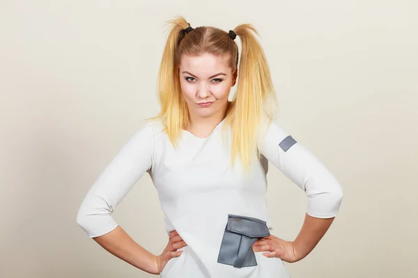 Grumpy blonde teenager girl with ponytails — Stock Photo, Image