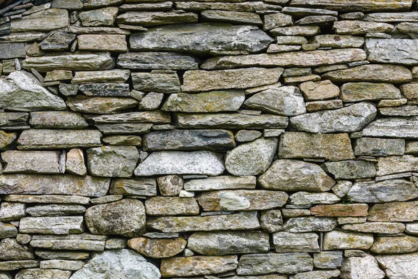 Pared de fondo hecha de piedras grises —  Fotos de Stock