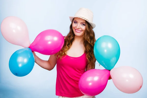 Woman playing with many colorful balloons — Stock Photo, Image