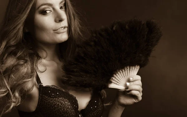 Woman holding carnival feather fan in hand. — Stock Photo, Image