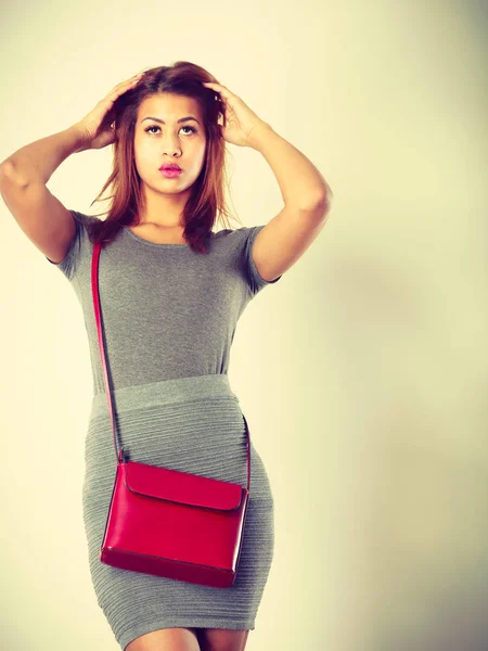 Mulatto girl gray wear with red handbag — Stock Photo, Image