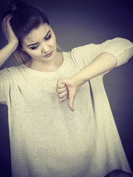 Sad woman showing thumb down gesture — Stock Photo, Image