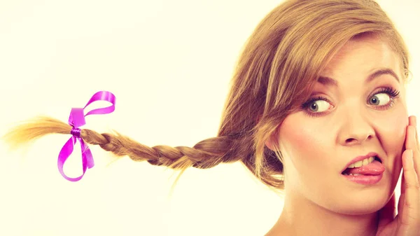 Teenage girl in braid hair making funny face — Stock Photo, Image
