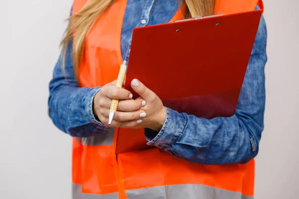 Woman engineer construction builder holds file pad. — Stock Photo, Image