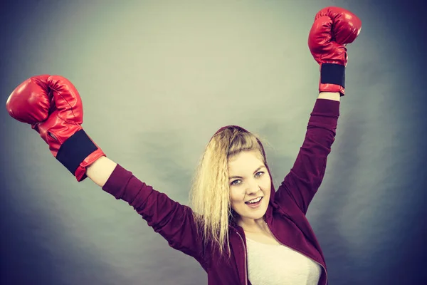 Woman winner wearing boxing gloves — Stock Photo, Image
