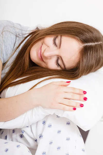 Tired girl hugging pillow. — Stock Photo, Image