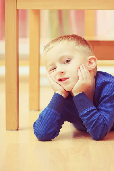 Kid making funny faces being bored — Stock Photo, Image