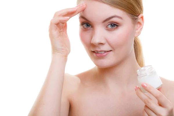 Woman applying face cream with her finger — Stock Photo, Image