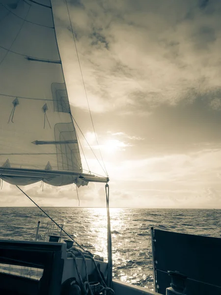 Yachting on sail boat during sunny dark weather — Stock Photo, Image