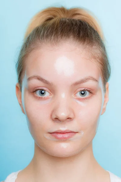 Woman in facial peel off mask. — Stock Photo, Image