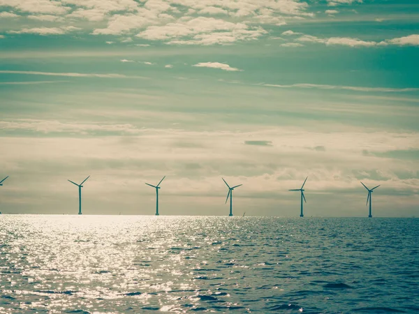 Wind turbines power generator farm along coast sea — Stock Photo, Image