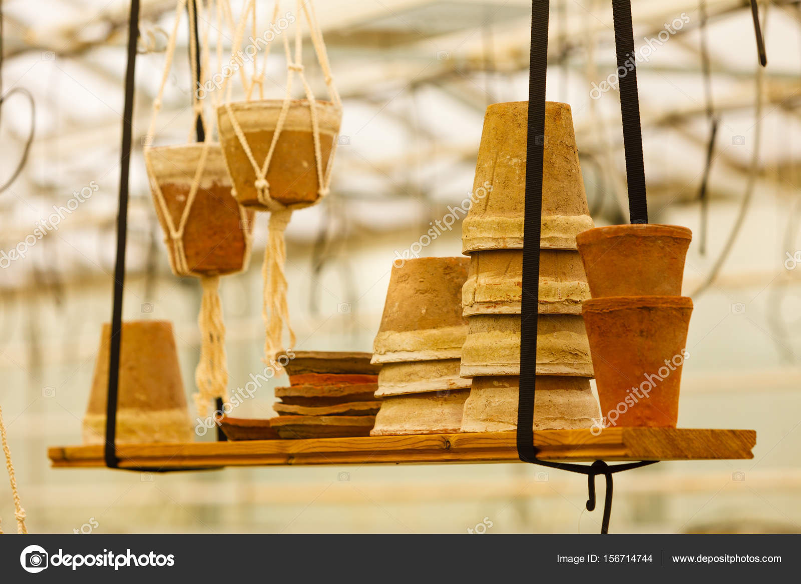 Ceramic Pots On Shelf Hung From Ceiling Stock Photo