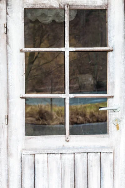 Closeup of old white door with handle — Stock Photo, Image