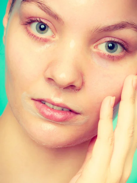 Close up woman in facial peel off mask. — Stock Photo, Image