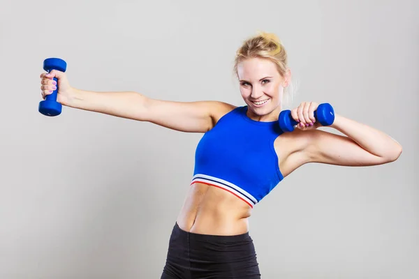 Fit woman lifting dumbbells weights — Stock Photo, Image