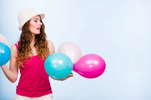Woman playing with many colorful balloons — Stock Photo, Image