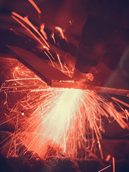 Laser cutting steel metal with bright sparks — Stock Photo, Image