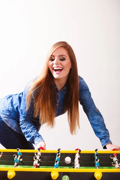 Woman playing table football game — Stock Photo, Image