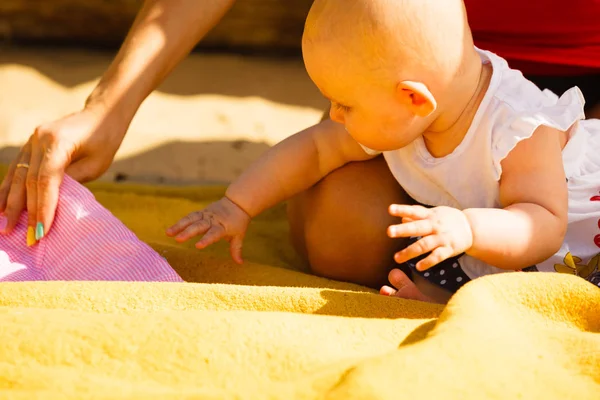 Little baby playing on beach during summertime — Stock Photo, Image