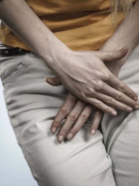 Woman with hands holding her crotch — Stock Image Woman with hands holding her crotch Stock Image