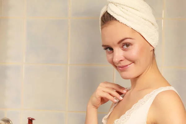 Woman in towel on her head in bathroom — Stock Photo, Image