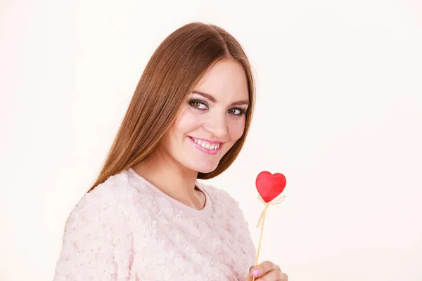 Beautiful woman holding heart shaped hand stick — Stock Photo, Image