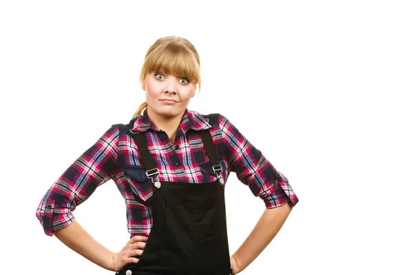 Surprised woman wearing dungarees and check shirt — Stock Photo, Image