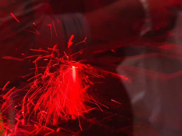 Laser cutting steel metal with bright sparks — Stock Photo, Image