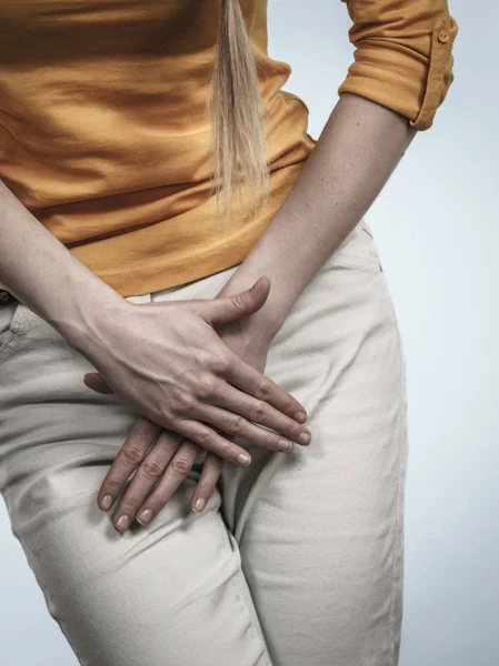 Woman with hands holding her crotch — Stock Image Woman with hands holding her crotch Stock Image