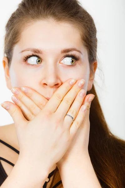 Shocked amazed woman covering mouth with hands — Stock Photo, Image