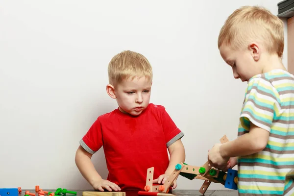 Two little boys playing with toys having fun — Stock Photo, Image