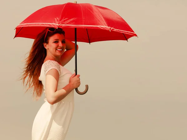 Portrait of redhead adult woman holding umbrella — Stock Photo, Image