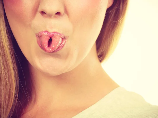 Funny blonde woman sitcking tongue out — Stock Photo, Image