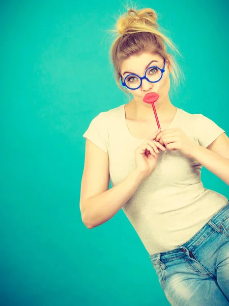 Happy woman holding fake lips on stick — Stock Photo, Image