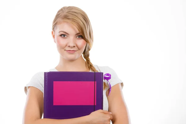 Young teenage student with braid holding books — Stock Photo, Image