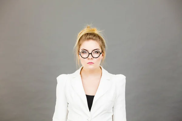 Bored focused college woman teacher wearing eyeglasses — Stock Photo, Image