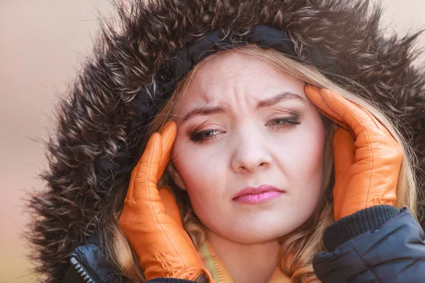 Woman suffering from headache pain. Cold. Stock Photo