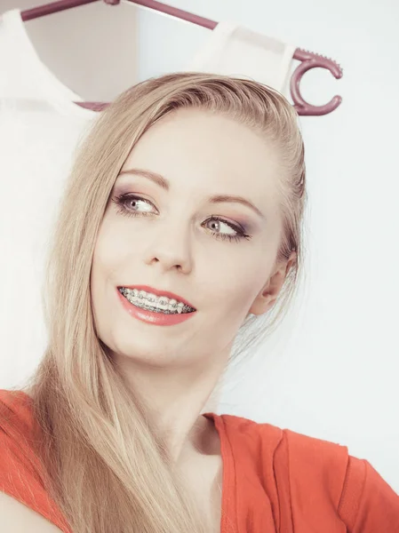 Elegant woman showing her teeth with braces — Stock Photo, Image