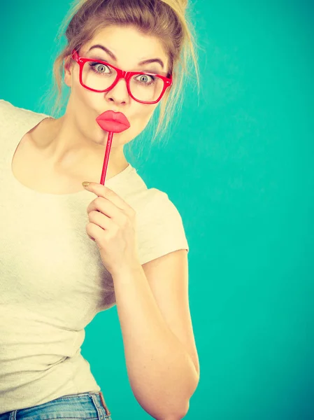 Happy woman holding fake lips on stick — Stock Photo, Image