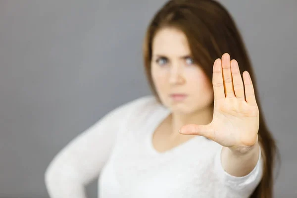 Angry apodicticity woman showing stop with hand — Stock Photo, Image