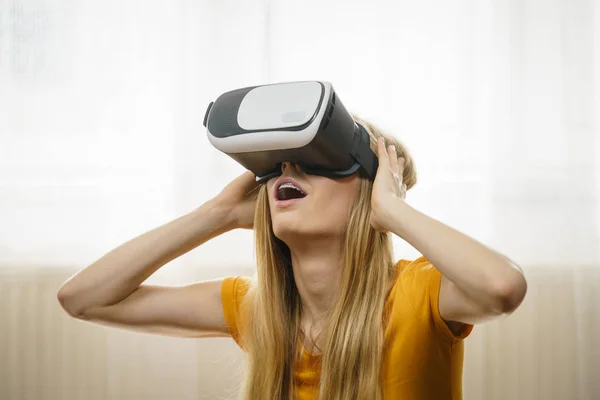 stock image Girl wearing virtual reality goggles.