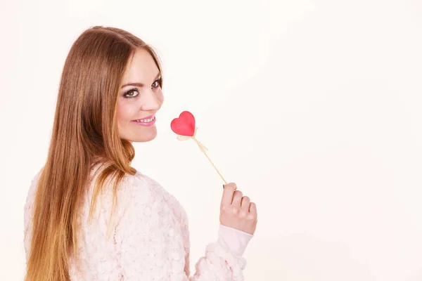 Beautiful woman holding heart shaped hand stick — Stock Photo, Image