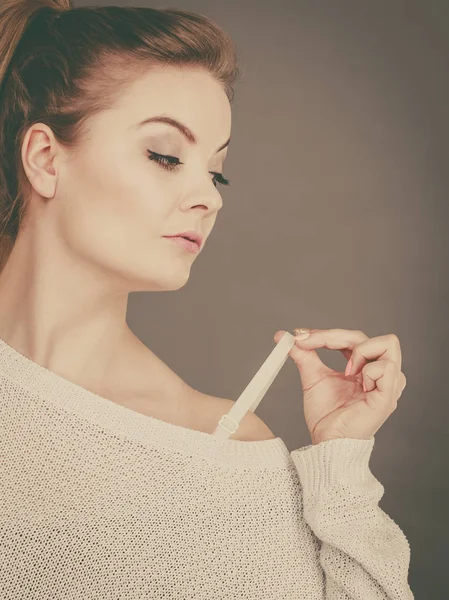 Woman holding her bra strap — Stock Photo, Image