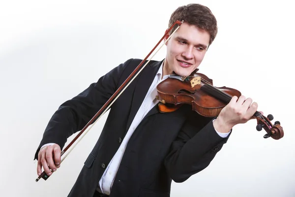Мужчина, элегантно одетый, играет на скрипке — стоковое фото