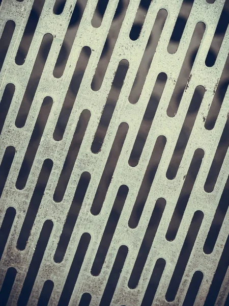 Primer plano abstracto de la textura de acero con agujeros —  Fotos de Stock