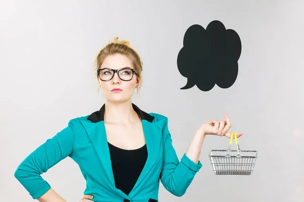 Business woman holding small tiny shopping cart — Stock Photo, Image